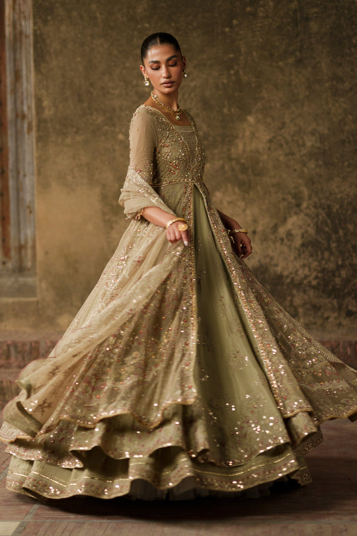 Yunra sand brown layered maxi in motion highlighting embroidered panels and full flowing flare.