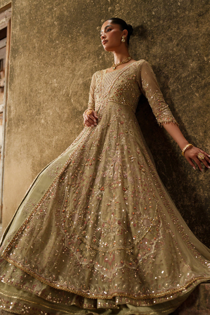Yunra sand brown formal maxi side view with fitted extended sleeves and layered silhouette.