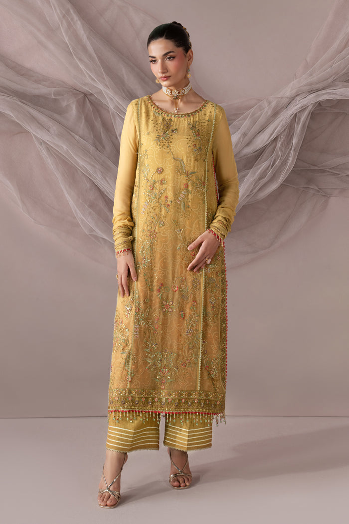 Full-length front view of Zahwa showing the golden embroidered shirt, PK Raw Silk culotte and layered semi-formal styling.