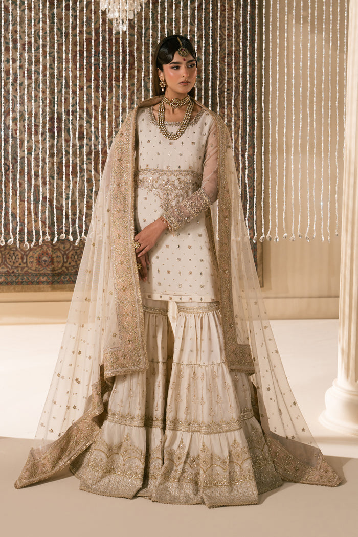 Zaleena honey beige Nikkah bridal dress by NAQSHI, full front view with organza embroidered shirt, layered jipsi gharara, net dupatta and matching pouch, ready to wear 4-piece formal wedding outfit.