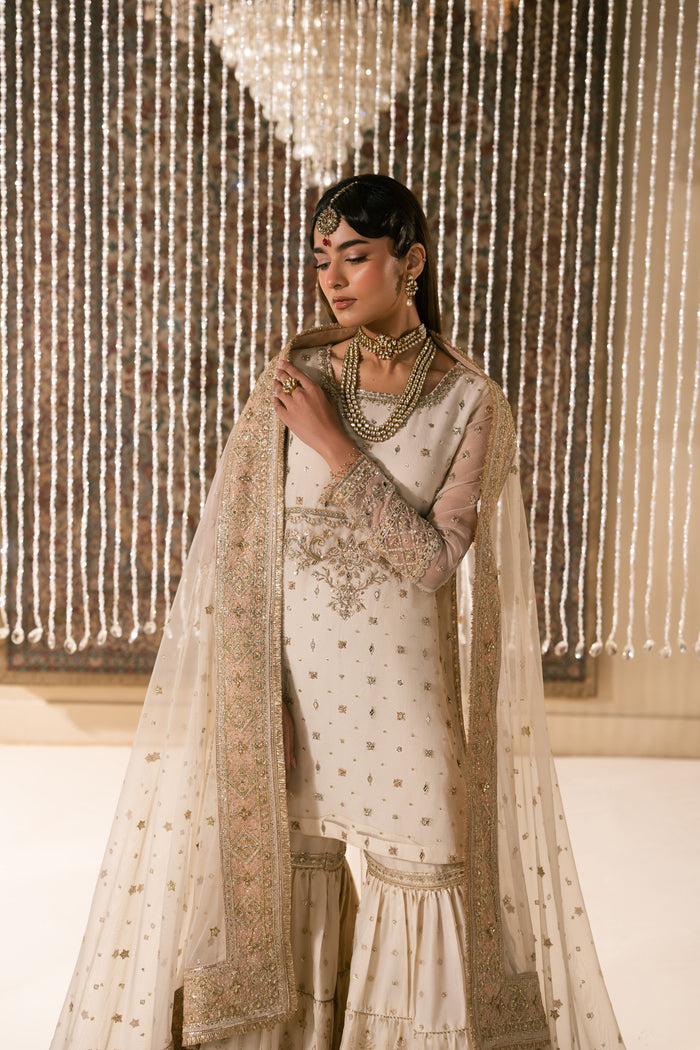 Front styling view of Zaleena Nikkah dress highlighting balanced embroidery, straight shirt cut and soft dupatta drape, elegant ready to wear wedding attire.