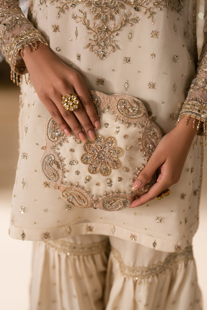 Close up detail of Zaleena organza shirt embroidery and sleeve border work in honey beige tone, neat stitching formal Nikkah outfit for women.