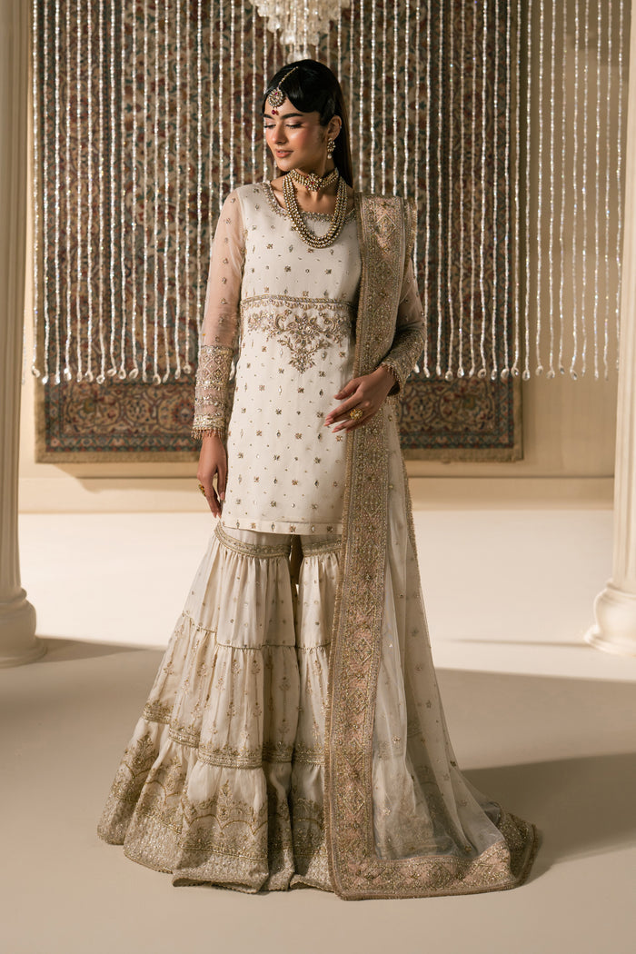 Full standing look of Zaleena honey beige gharara suit with layered flare and bordered dupatta styling, complete ready made bridal Nikkah dress.