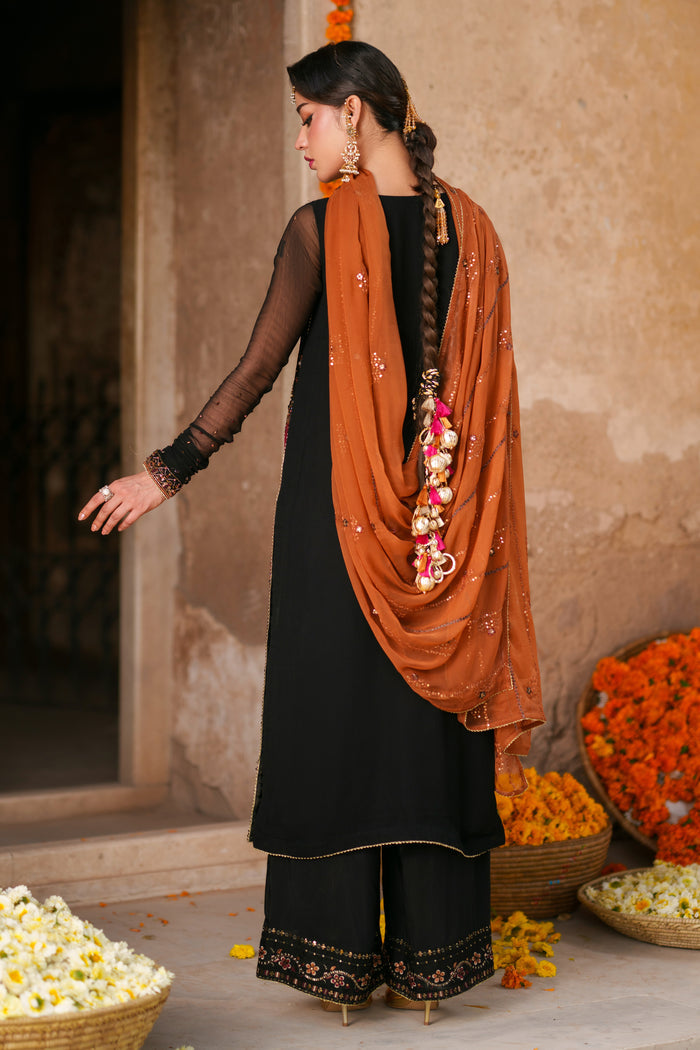 Three piece black and orange crinkle suit with long embellished shirt, PK raw silk culottes and draped festive dupatta