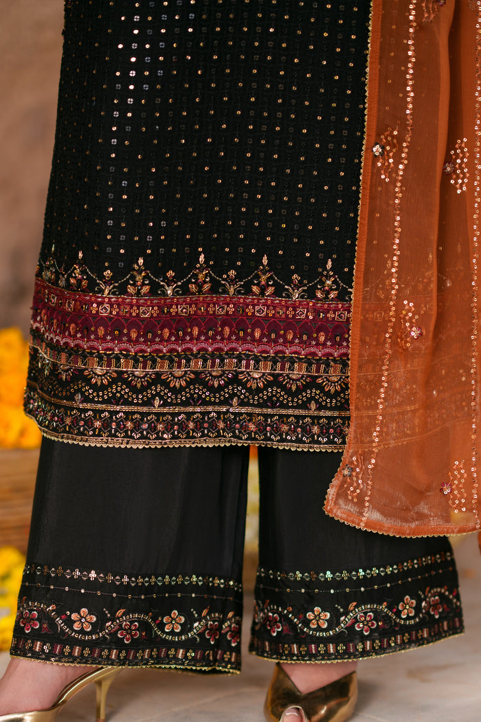Close-up of embroidered hem border with sequins embellishment on Zarim black crinkle semi formal outfit