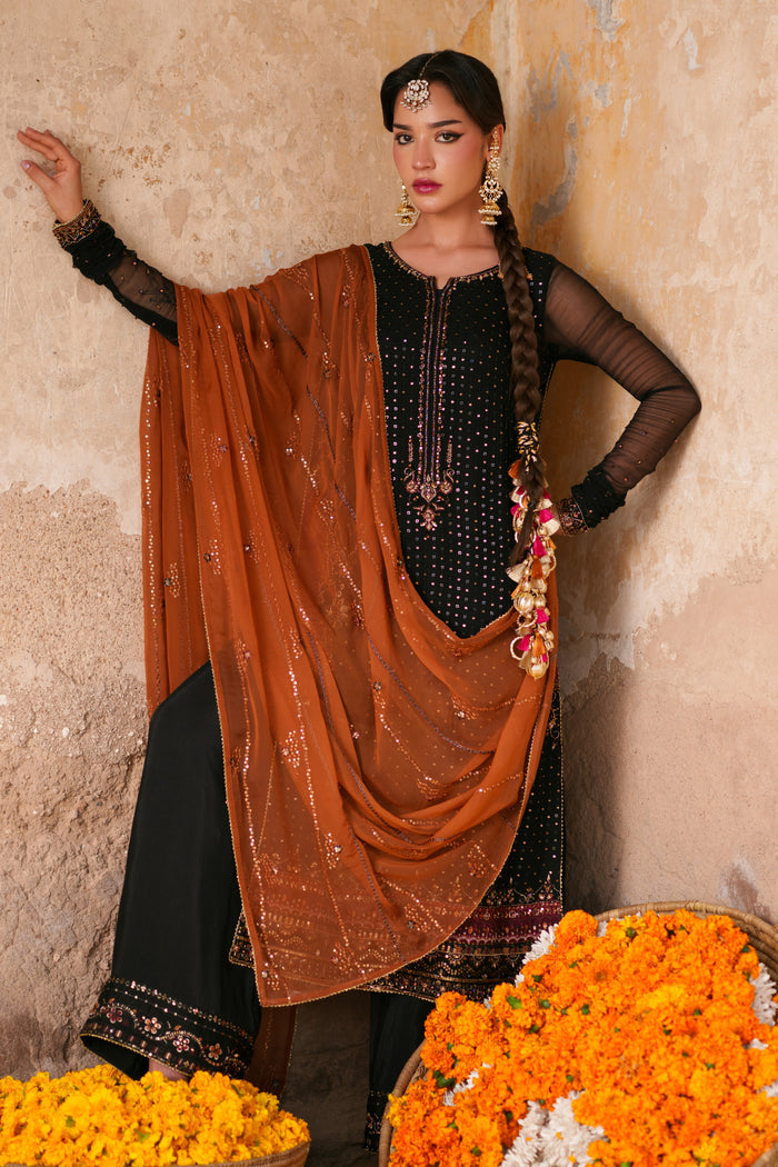 Black crinkle semi formal dress with orange embellished dupatta, detailed adda work and elegant Eastern wear silhouette