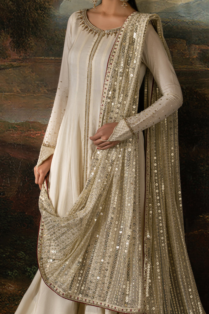 Close-up of Zarsanga showing Adda work, tilla, sequins and contrast thread detailing on the off-white frock and dupatta border.