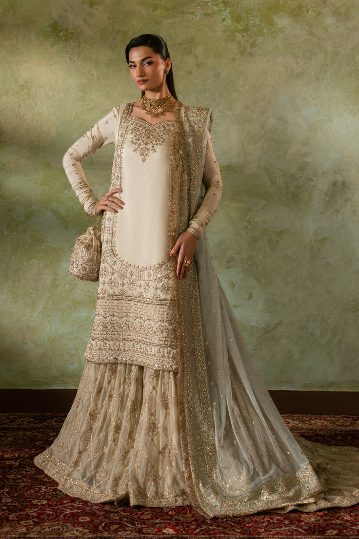 Zemira beige and peach Nikkah bridal outfit by NAQSHI, full front view with raw silk embroidered shirt, farshi gharara, net dupatta and matching pouch, ready to wear 4-piece formal wedding dress.