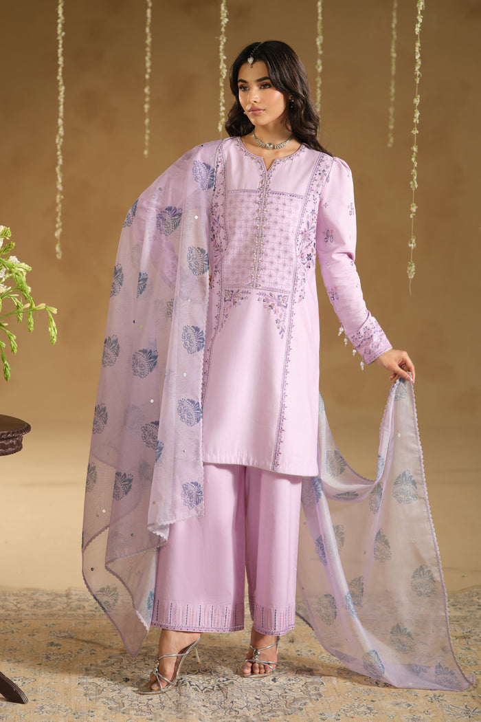 Full length side pose of Zimda light purple festive dress showing modest shirt silhouette and straight culotte trousers