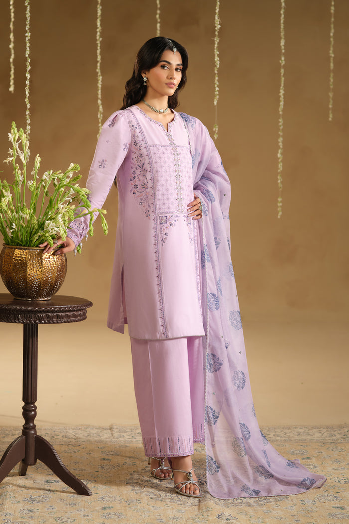 Close up of Zimda neckline embroidery and puff sleeve detailing on light purple Pima lawn fabric