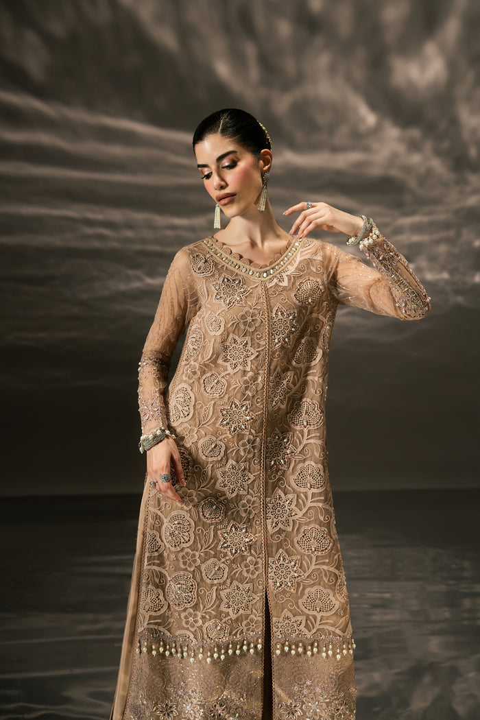 Front three-quarter view of Zita evening wear highlighting the embroidered Organza shirt, lower border details and wide PK Raw Silk pants.