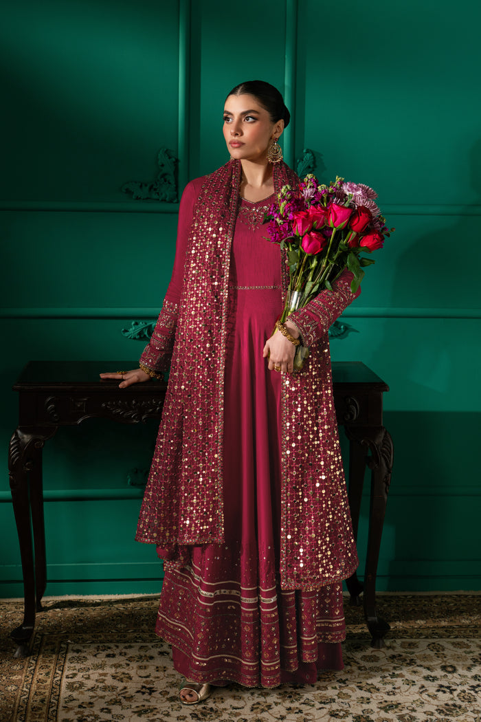 Full-length view of Zoraida showing the shocking pink wide-flare frock, PK Raw Silk sharara and draped embroidered Net dupatta.