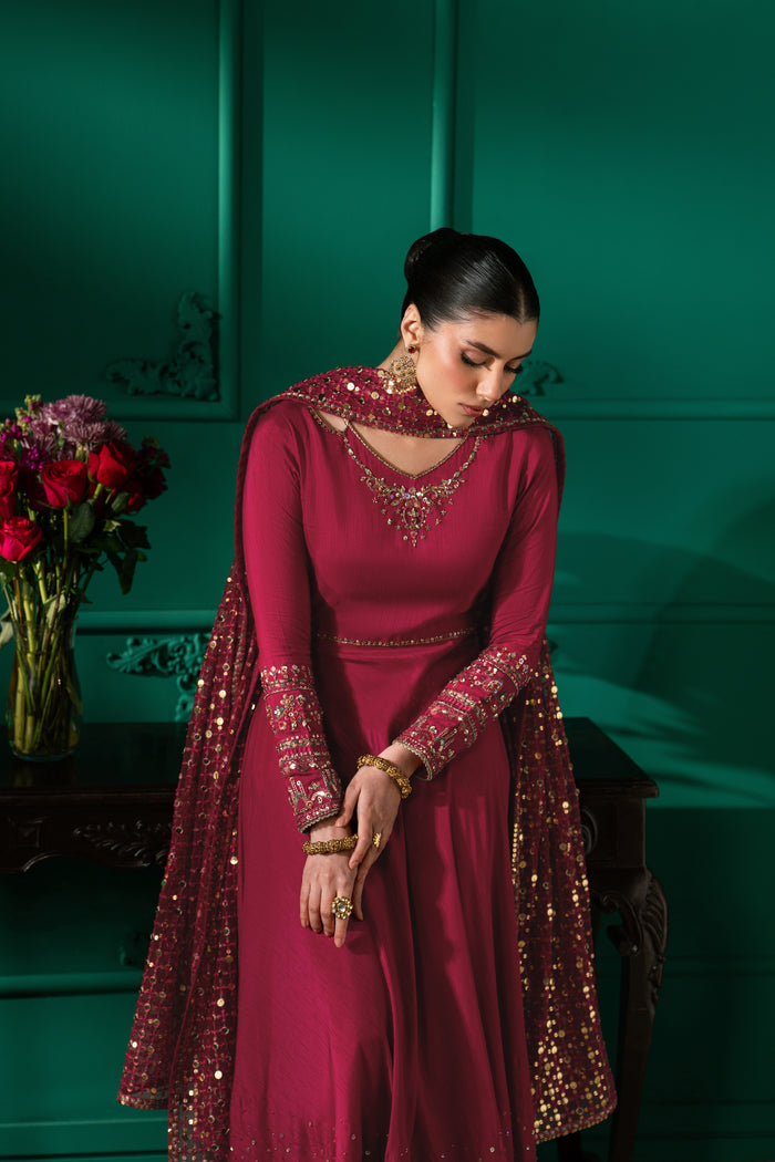 Front pose of Zoraida showing the fitted bodice, flowing shocking pink frock and softly draped Net dupatta.